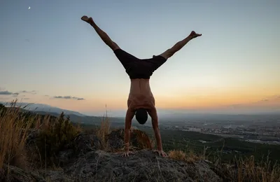 Group doing calisthenics exercises outdoors in Alcalá at sunset