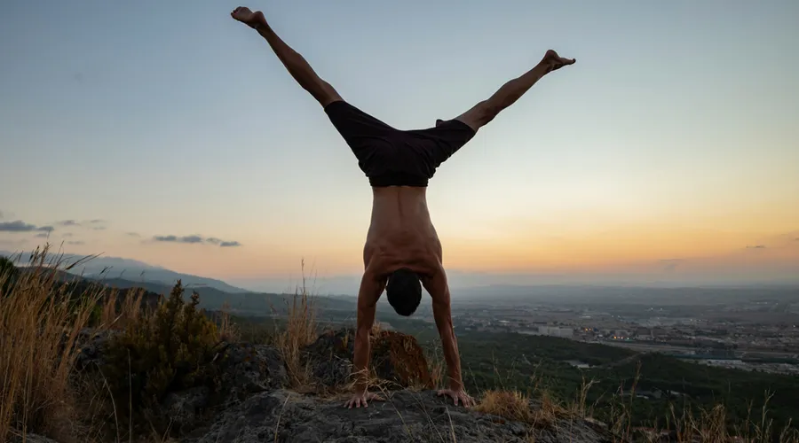 Group doing calisthenics exercises outdoors in Alcalá at sunset