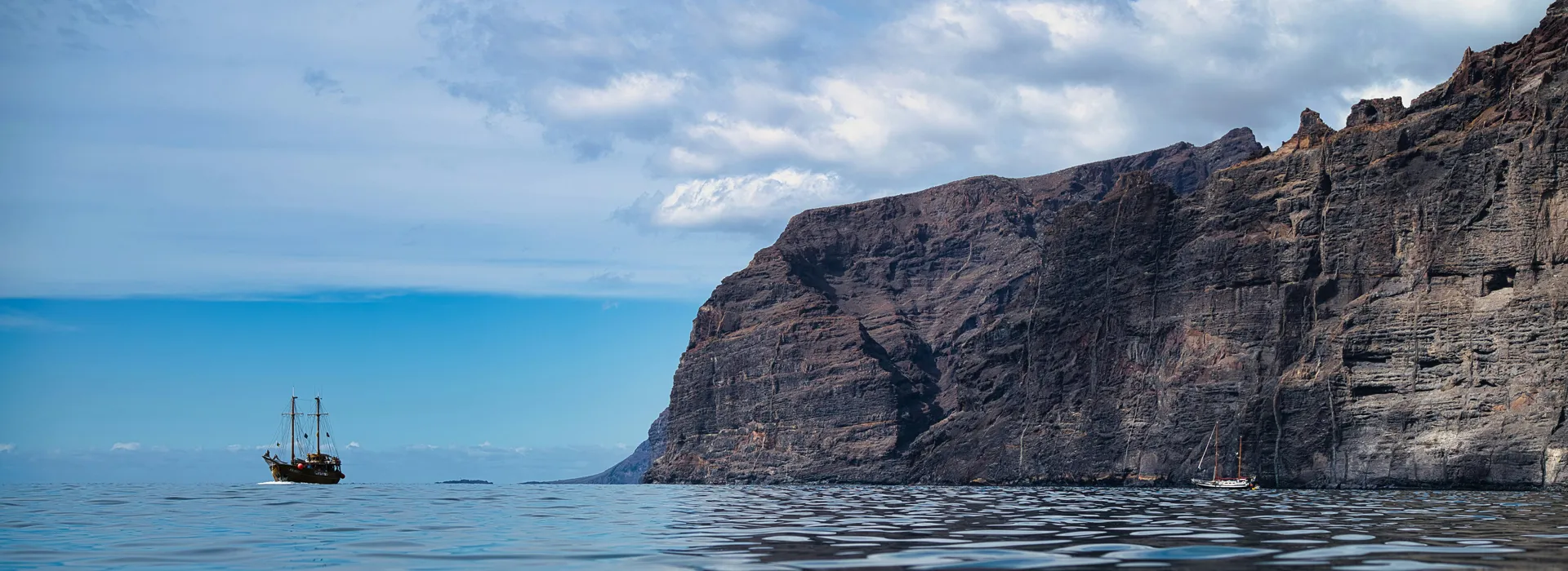 The Los Gigantes cliffs with a boat in the foreground